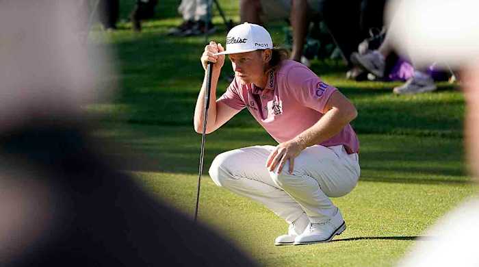 Cam Smith lines up a putt at the 2022 Masters Tournament.